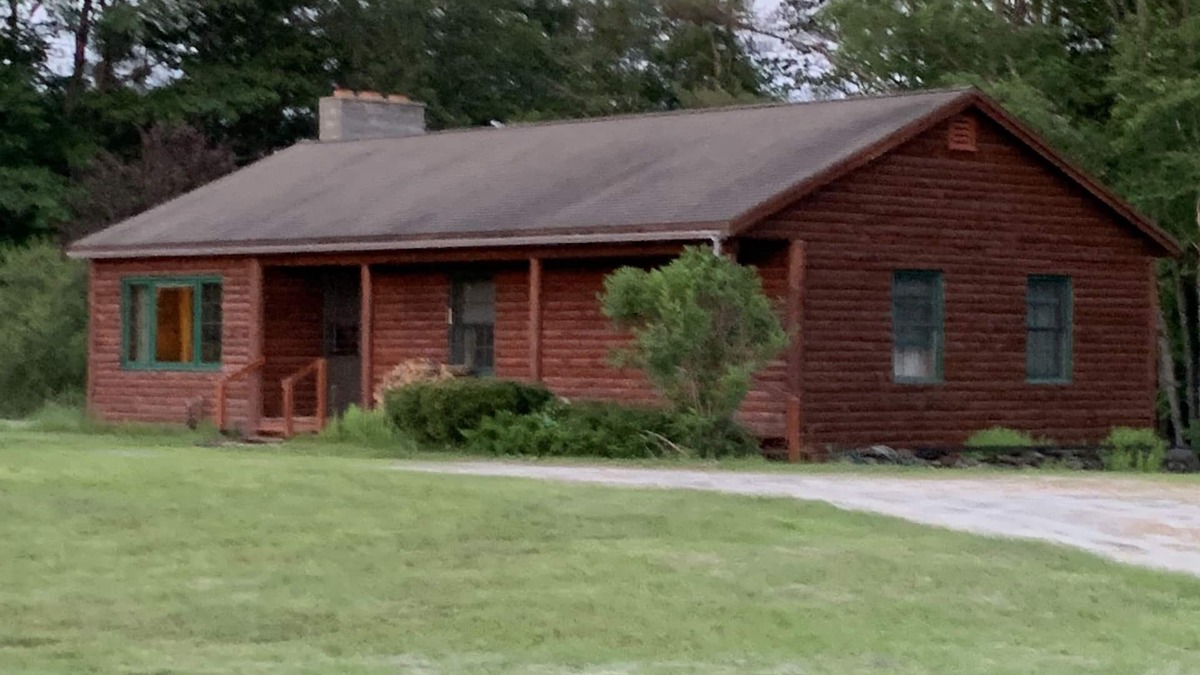 Newport Cabin | Cabin is nestled near the Sugar River in a country setting next to a open field.