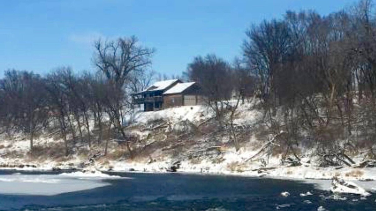 Larchwood House | Cabin on bluff of Big Sioux River with rushing waters of the Klondike Dam below.