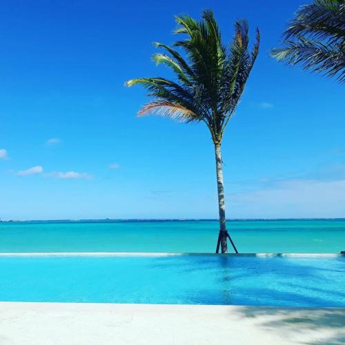Nassau House | Cable Beach Condo Large private patio with BBQ