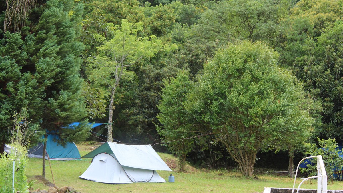 Munhoz RV Rental | Camping area with waterfall and small beach in the Serra da Mantiqueira in Munhoz-MG