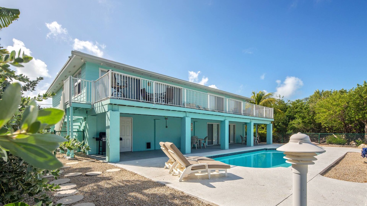 Marathon House | Canal-front, dog-friendly home with heated pool, seawall dock & grill