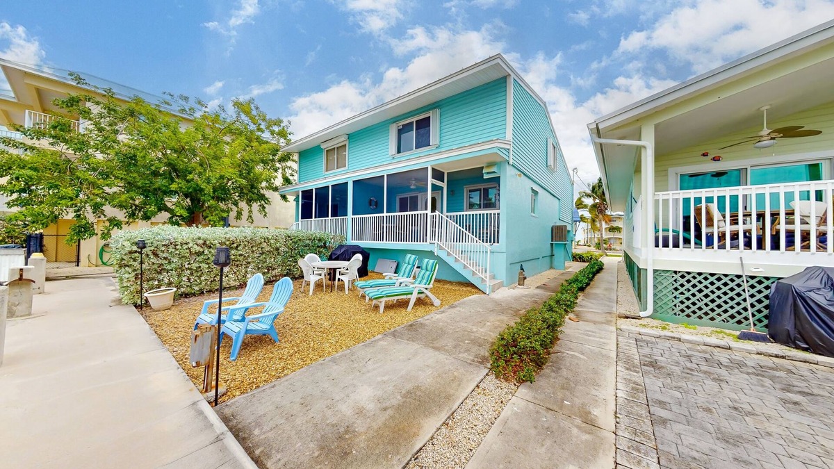 Key Colony Beach House | Canal-front duplex with Cabana Club membership, private dock, canal views, grill