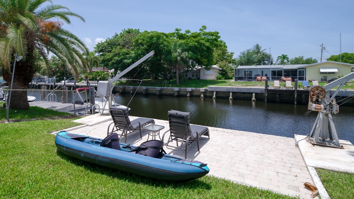 Cypress Lakes House | Canal-front home with pool, dock, patio, grill, sundeck, AC & washer/dryer