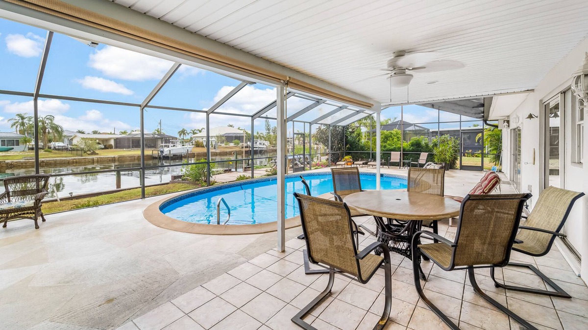 Edgewater House | Canal-front home with deep-water dock, pool, lanai, & central AC - snowbirds OK