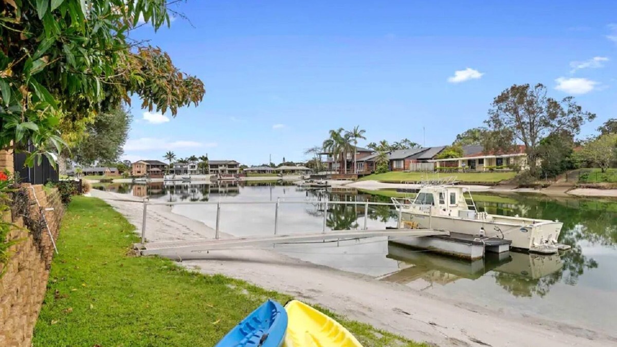 Tweed Heads Apartment | Canal living with private beach, boat ramp, pontoon, fishing and kayaks.