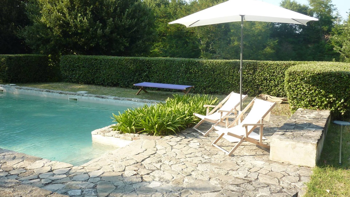 Santa Vittoria in Matenano Villa | Casale Oliva in a landscape of oaks, olives and cherry trees.