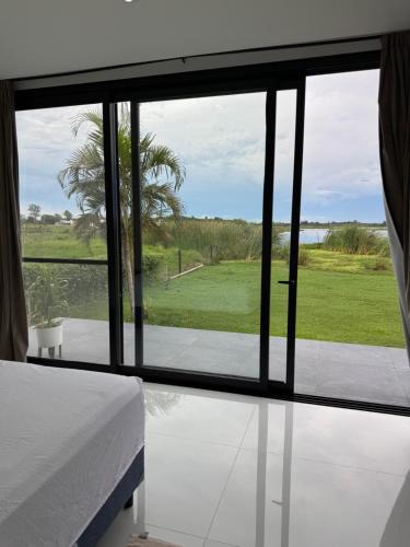 Corrientes House | Casa sobre Laguna Brava - Tranquilidad y Naturaleza en Barrio Privado
