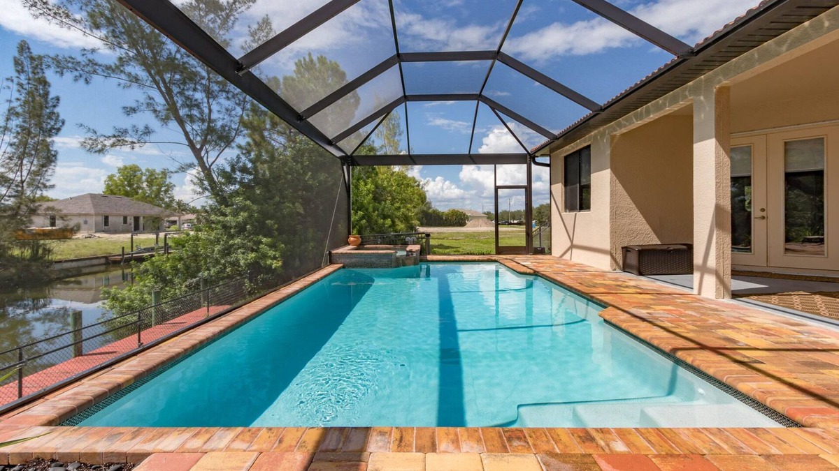 Trafalgar House | Casita Cabo Coral on Gulf Access Canal with Heated Salt Pool & Spa