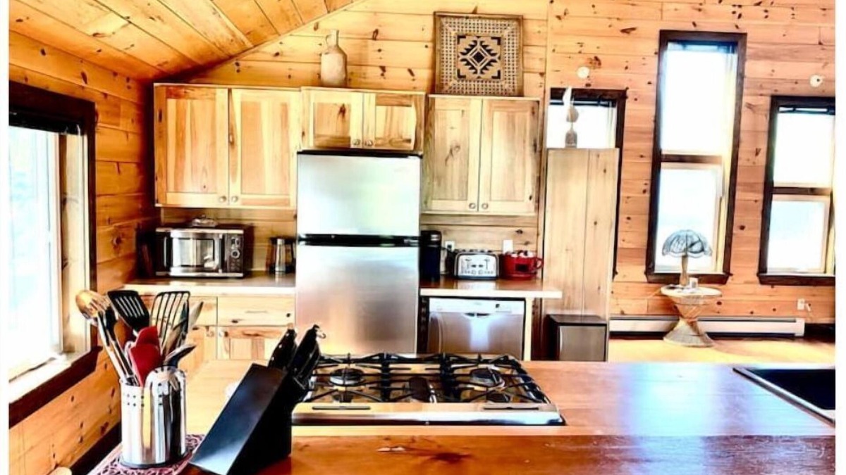 Britt Cottage | Cathedral pine cabin on the river, Open concept