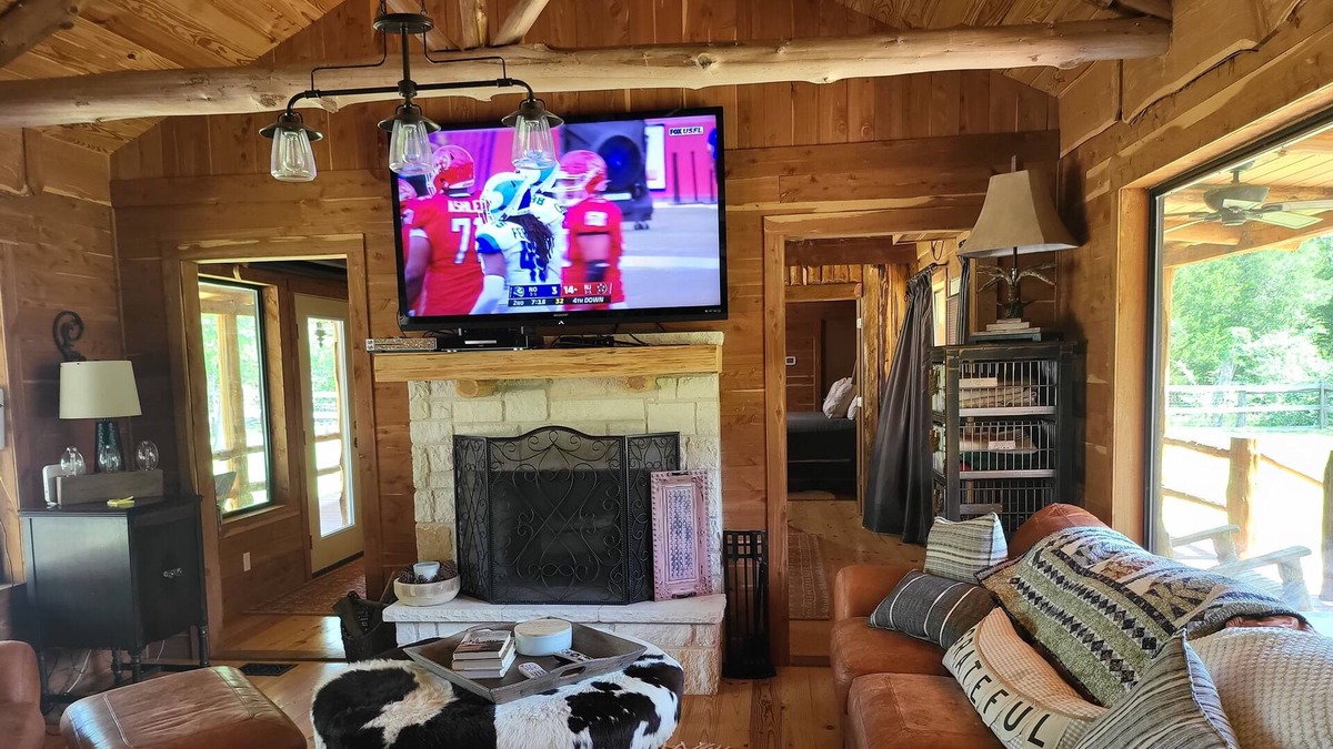 New Ulm Cabin | Cedar Acres offers a 3 Bedroom Log Cabin that overlooks a pond.