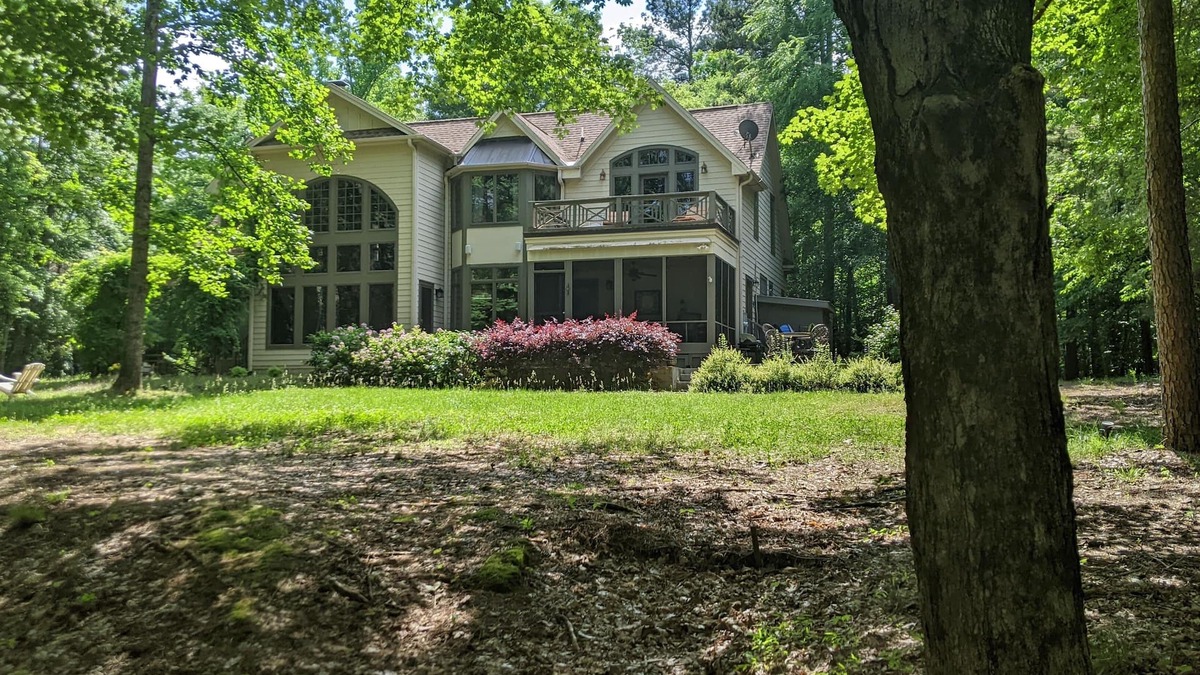 Henderson House | Celebrate Spring! Beautiful, custom Kerr Lake lodge home + private dock.