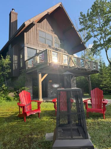 Lac Superieur Village Ski Chalet | Chalet Inukshuk Luxury Log Cabin with Spa Lake View and Club Access near Mont Tremblant