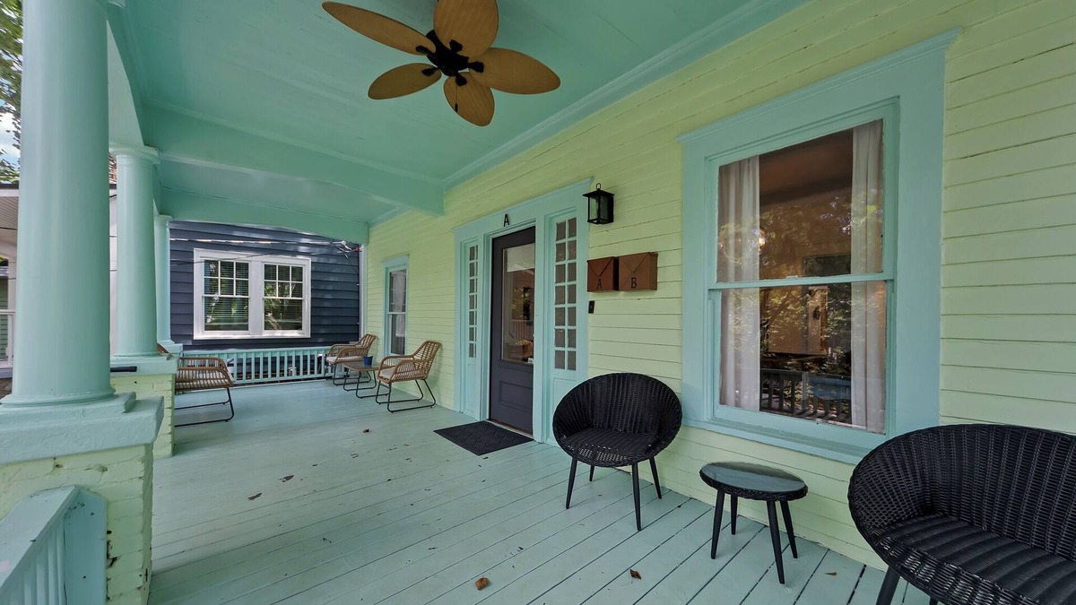 Inman Park Apartment | Charming 2BR/2BA lower-level unit in a classic Inman Park duplex. Features full kitchen, cozy living area with fireplace, Southern-style front porch, clawfoot tub, in-unit laundry, and dedicated parking. Walkable to dining and MARTA.