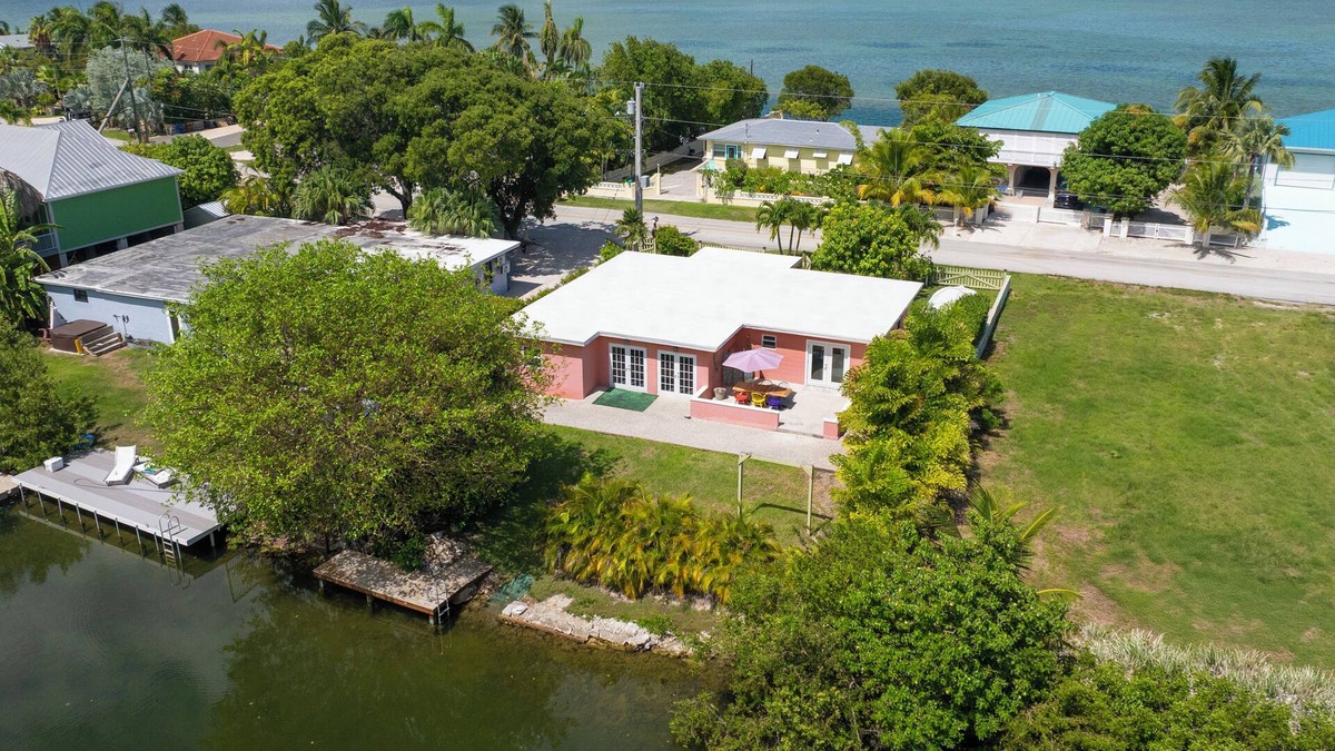 Bay Point House | Charming 3BR canal home close to Key West with kayaks, bikes and park access.