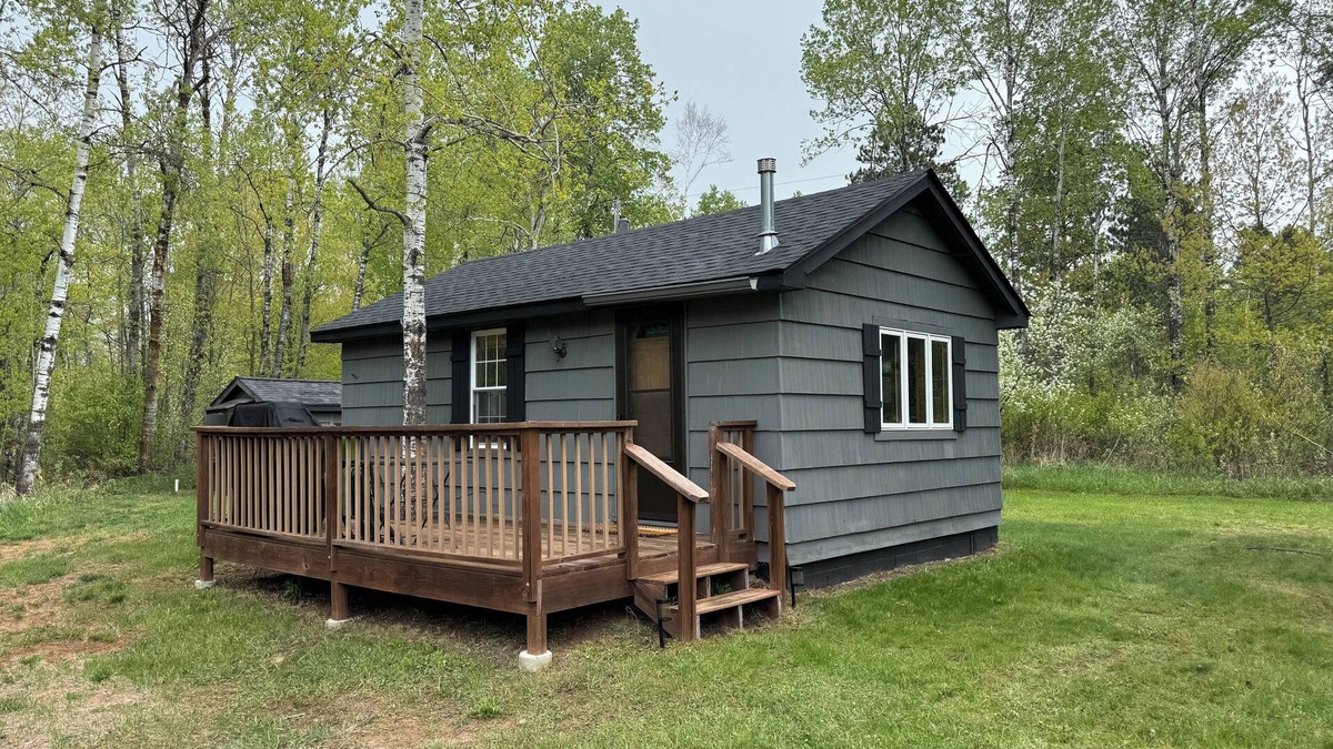 Kerrick Cabin | Charming cabin in delightful Duquette with AC near miles of ATV trails.