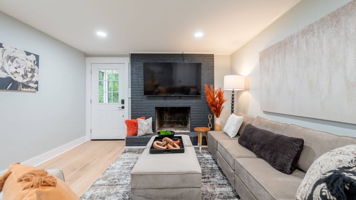 Blacksburg House | Charming cottage entrance with cozy curb appeal, nestled in a peaceful and green setting.