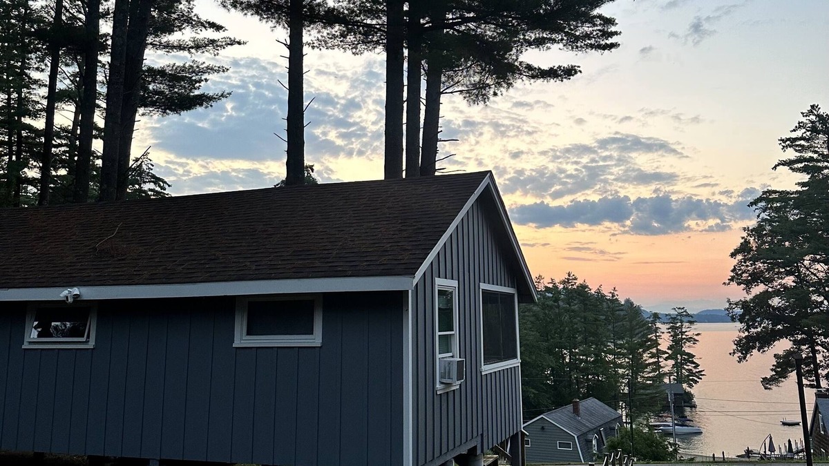 Alton Bay Cottage | Charming cottage with beach access, a grill, dock, & nearby golf