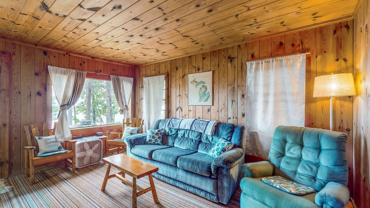 Topinabee Cottage | Charming lakefront cottage with large yard, dock, & fire pit - close to downtown