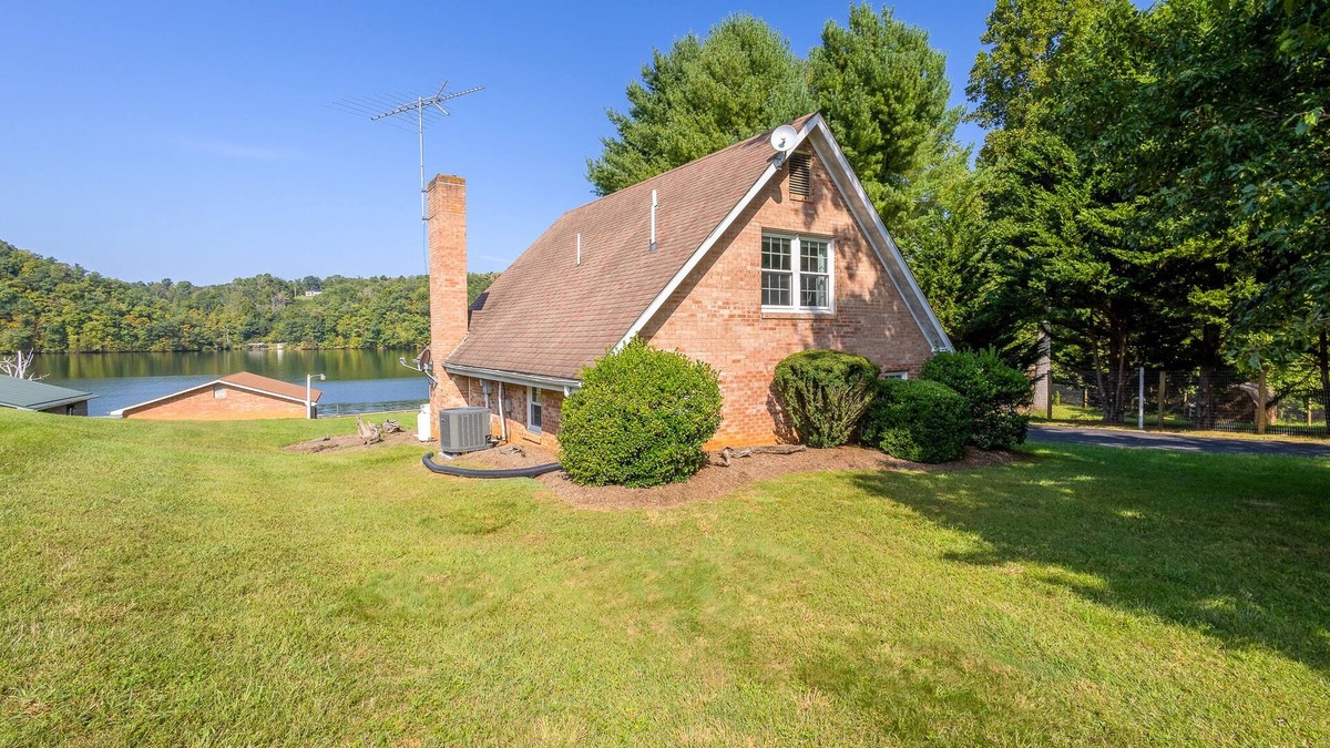 Ingles House | Charming lakefront retreat with cozy interiors, private dock, fire pit, and breathtaking water view