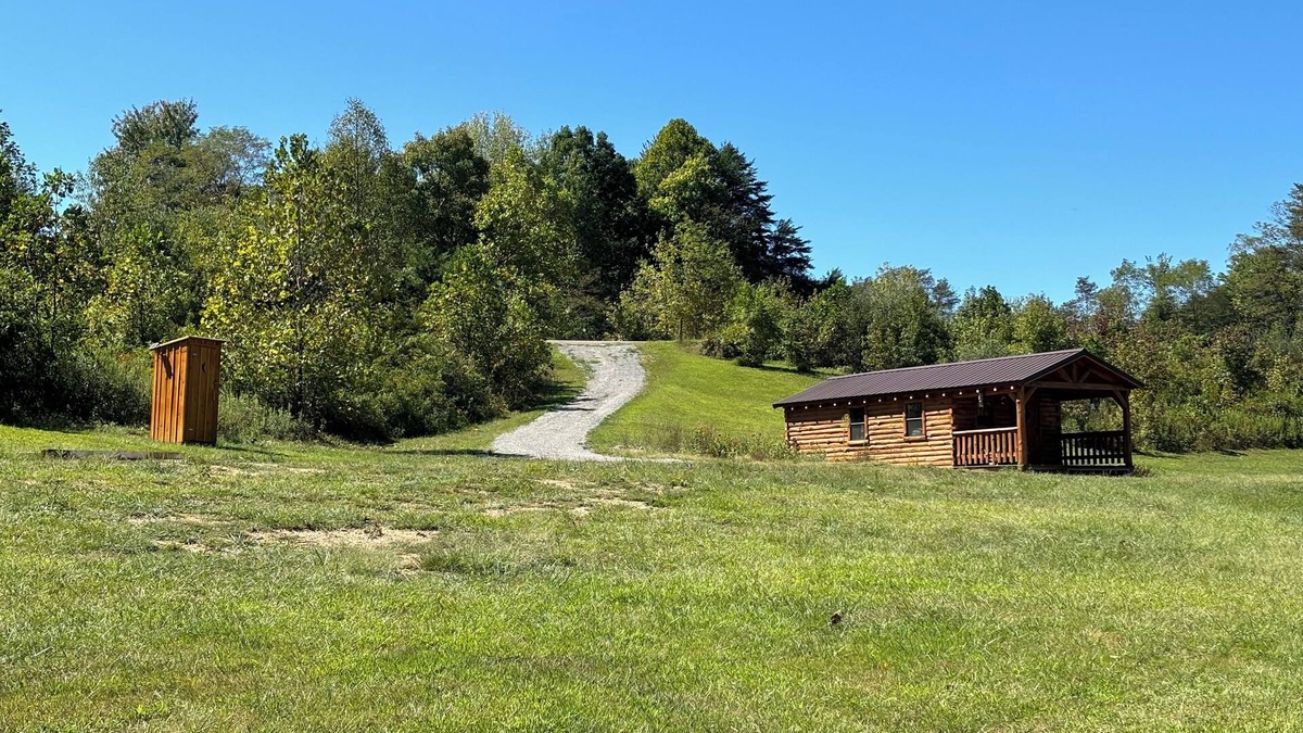 Kerr Apartment | Charming one-room cabin retreat with private bath, kitchenette and log gazebo.