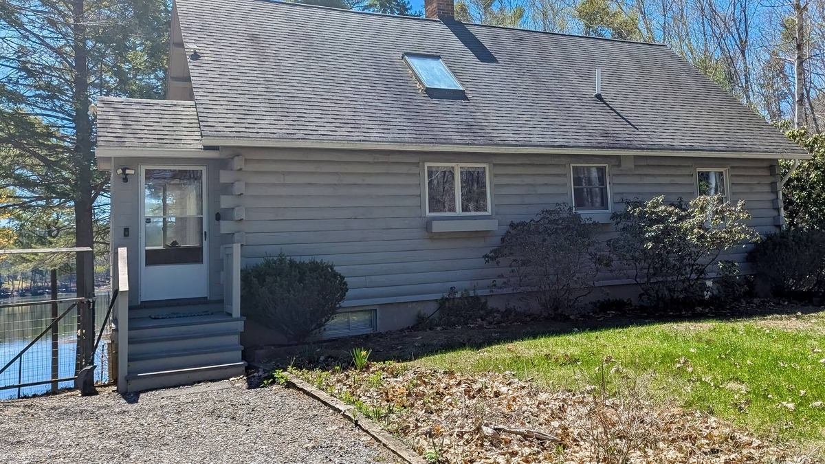 Wiscasset House | Charming riverfront home with cozy interiors, dock, and scenic deck views