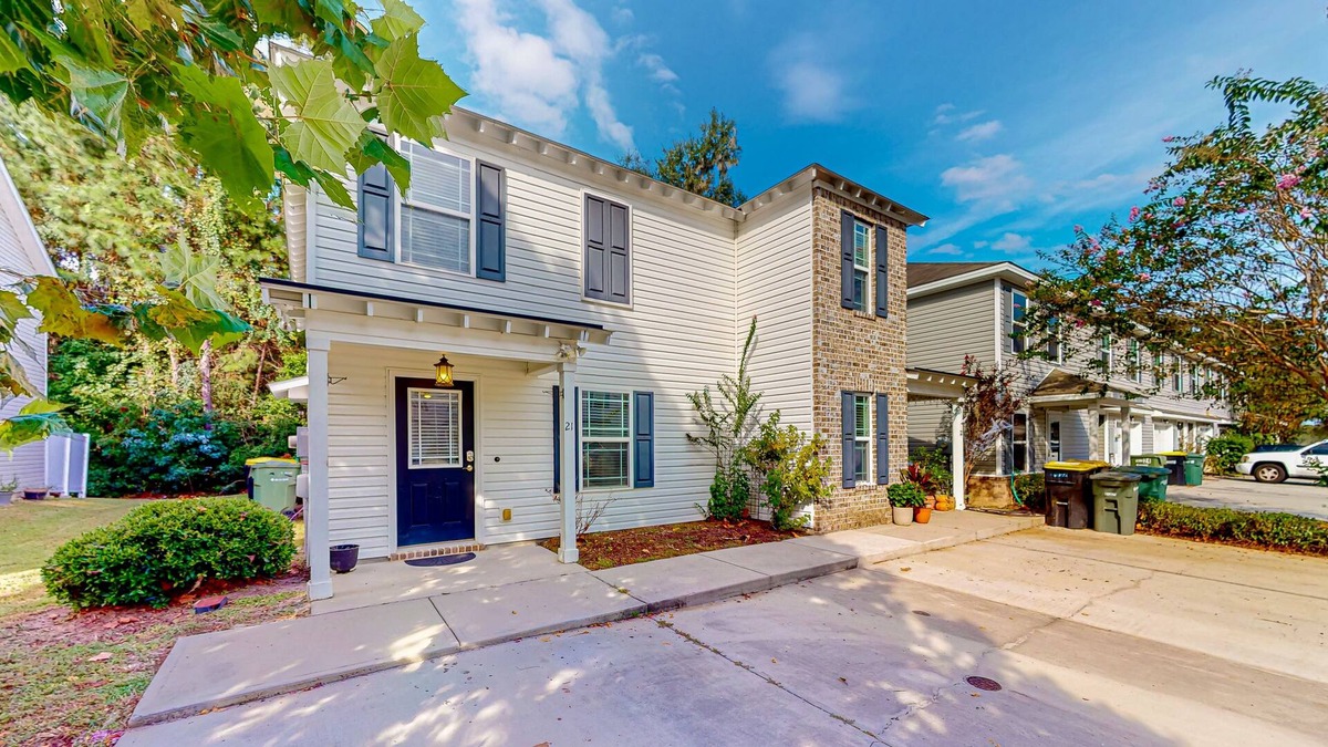 Savannah House | Charming townhome with tree-lined deck, pool and dock access, & updated interior