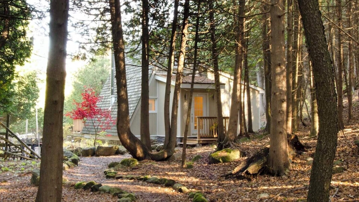 Grey Highlands Cabin | Charming updated A-frame home nestled in the woods adjacent to Kimberley Creek.