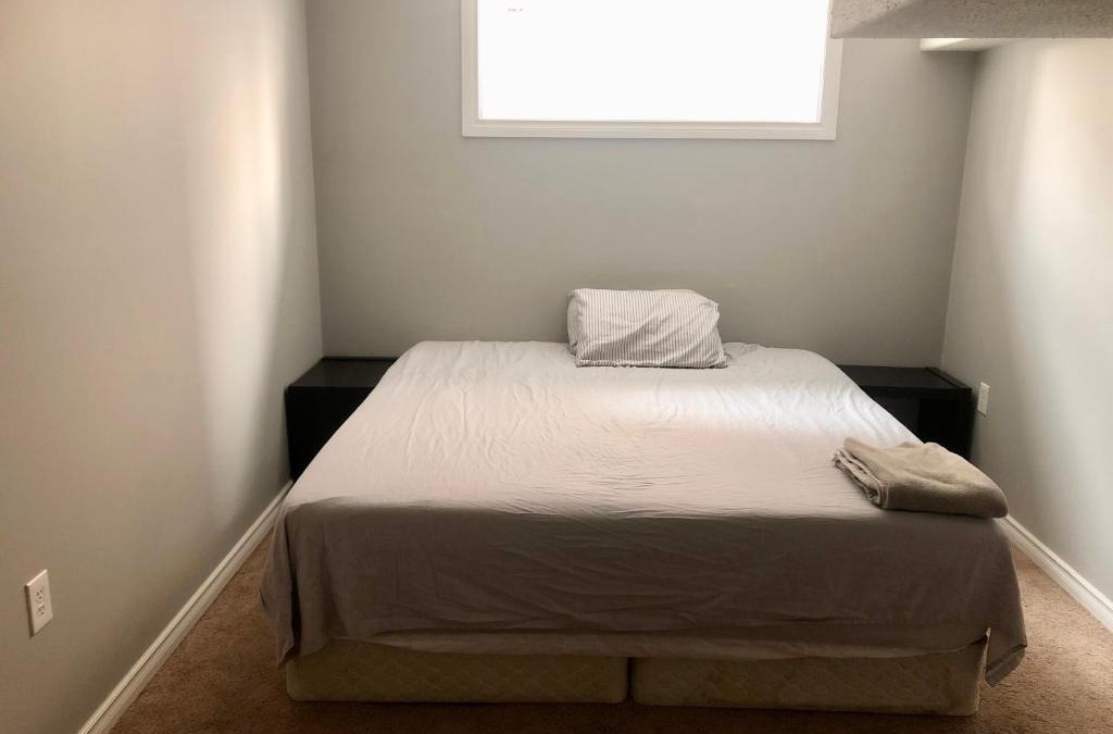 Chestermere House | Chestermere room with King sized bed