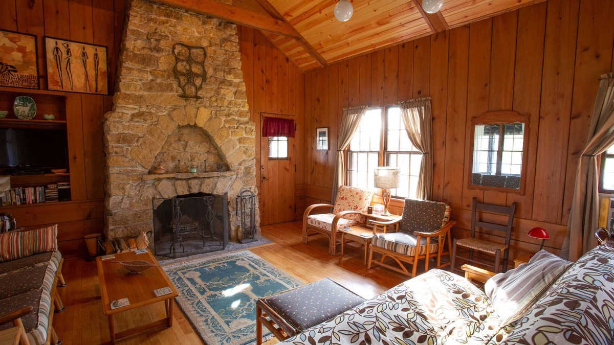 Lake Ripley Cottage | Classic cabin/cottage with big screen porch, stone fireplace, knotty pine walls.
