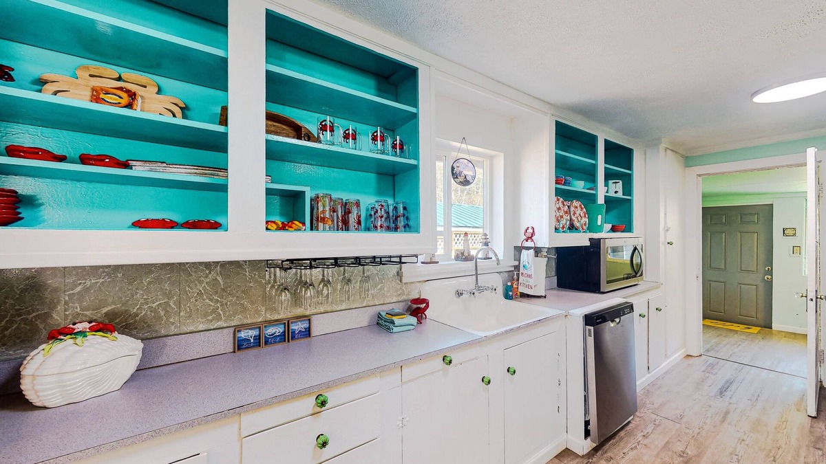 Winchester Bay House | Coastal home with an enclosed yard, hot tub, grill, fireplace, and W/D - dogs ok