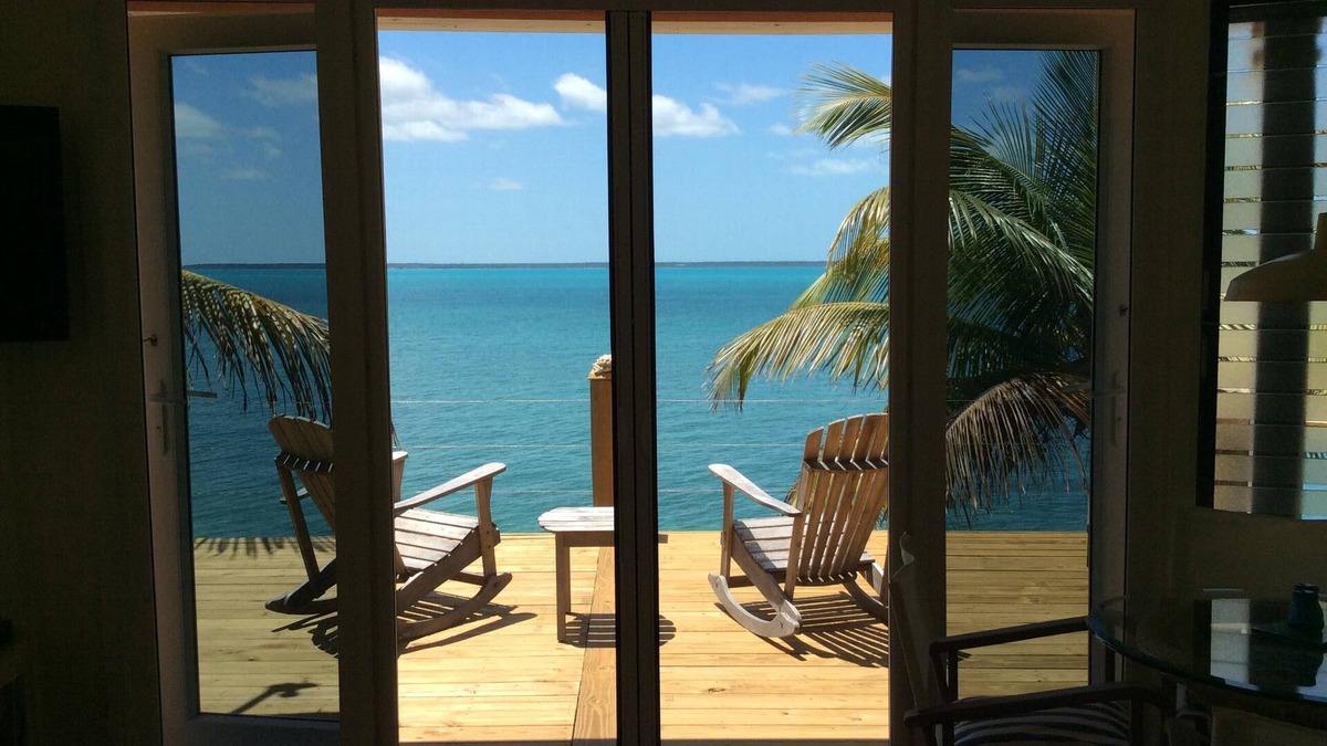 Green Turtle Cay Cottage | Coco Nut Tree House is nestled in Tropical Foliage on Crystal Clear Sea of Abaco