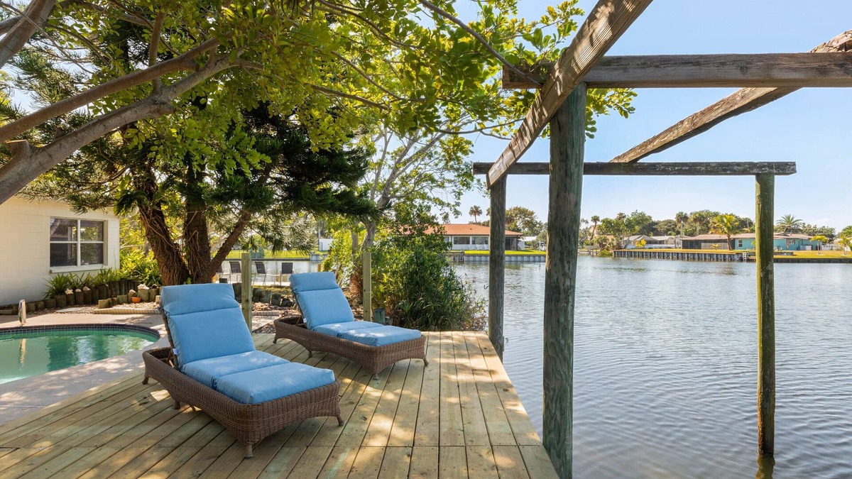 River Isles House | Coconut cove - peaceful garden retreat with HEATED pool on canal near the beach!