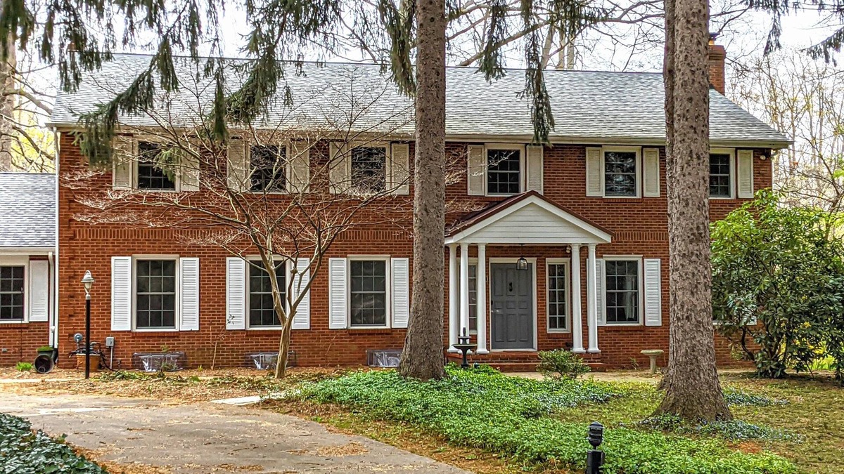 Benton Harbor House | Colonial style 5BR/5BA home tucked in a private, wooded setting w/pool & hot tub