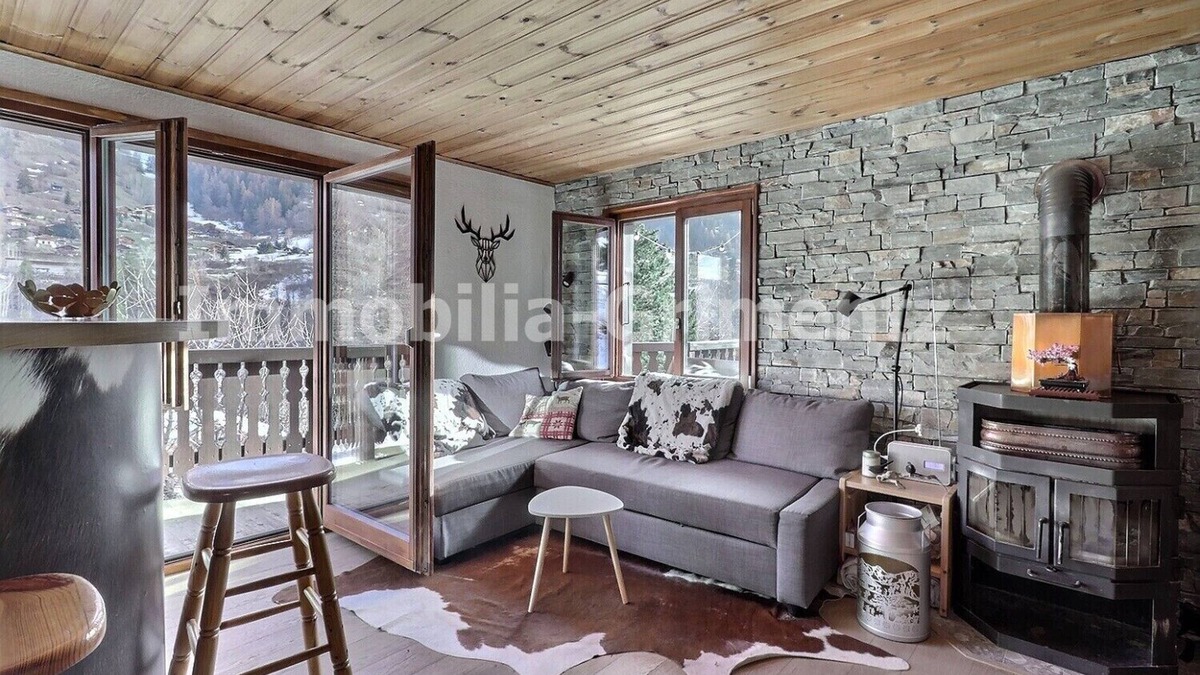 Lauenen Bei Gstaad Ski Chalet | Comfortable chalet on 3 levels for 5 people in Mayoux, living room with wood-burner, kitchen area wi