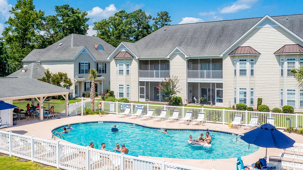 Little River House | Comfortable townhome with loft, shared pool, WiFi, AC, & W/D - near beach & golf