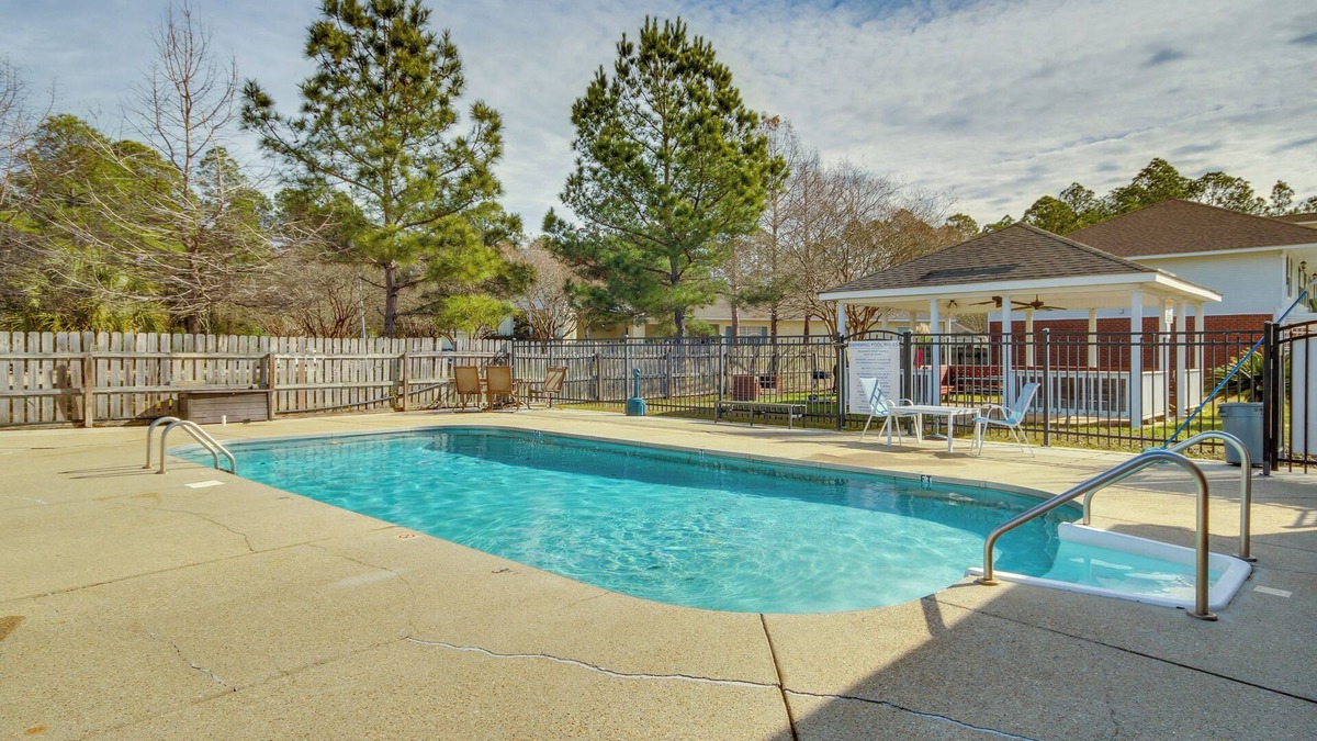 Gautier Condo | Community Grills & Pool: Gautier Condo!