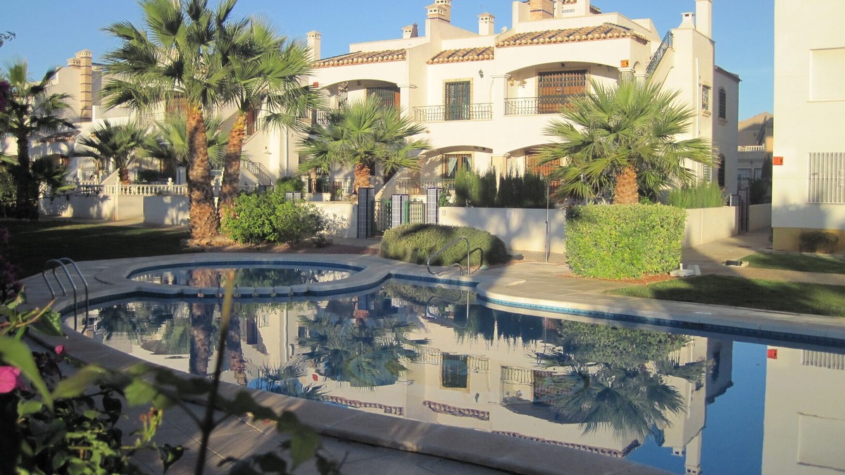 Orihuela Costa Apartment | condo in cozy garden beside the pool.