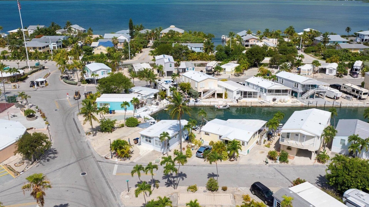 Cudjoe Key RV Rental | Corner RV Lot with Lagoon Views, Palm Trees, and Steps to Pool & Amenities