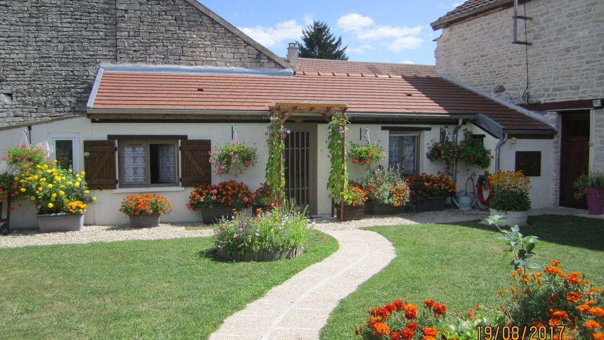 Tanlay Cottage | cottage commissey in a flower garden