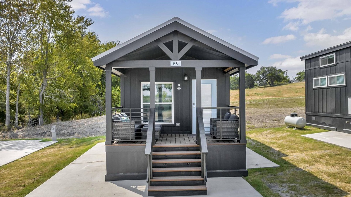 Brenham Cottage | Cottage with Bunk Beds - Includes 1 queen bed in the master, 2 bunk beds and 1 queen bed in the loft. A fully equipped kitchen, dining area, private bath and shower, TVs, Wifi, all utilities, access to all resort amenities. This cottage is pet friend