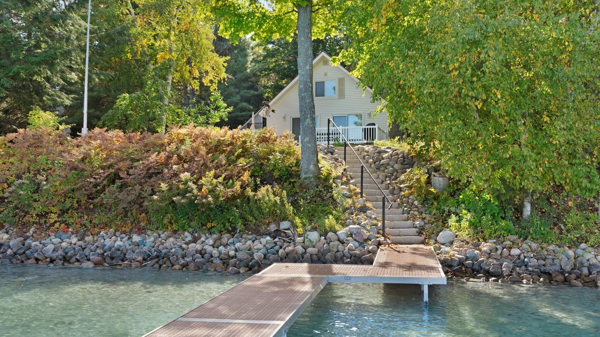 Boyne City House | Cottage with lake views, private dock & firepit - near public boat launch
