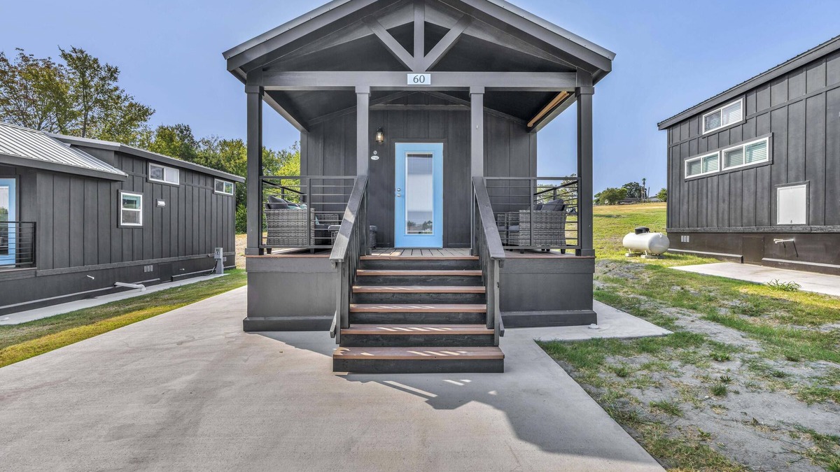 Brenham Cottage | Cottage with Loft - Pet Friendly - Includes 3 queen beds (one in master and 2 in loft), a fully equipped kitchen, dining area, private bath and shower, TVs, Wifi, all utilities, access to all resort amenities. This cottage is pet friendly.