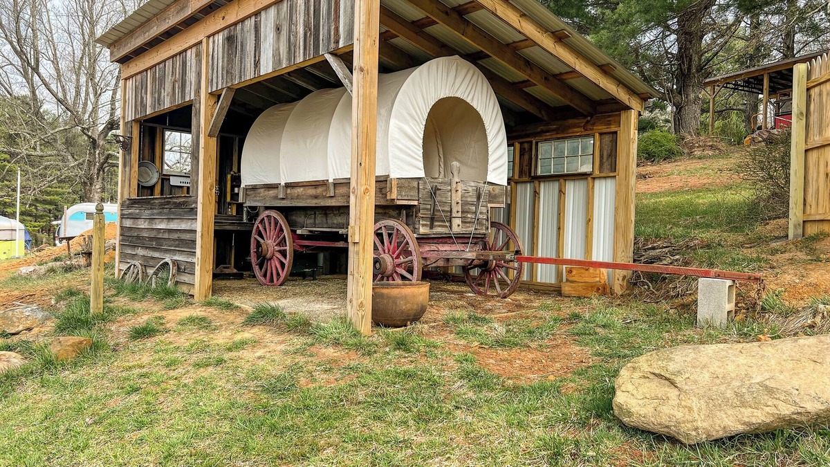 Floyd RV Rental | Covered Wagon Overlooking Pond