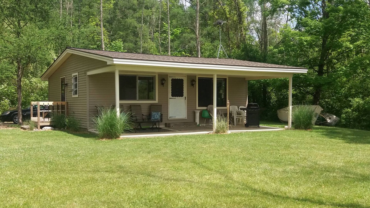 Allegan Cottage | Cozy 2-bedroom Waterfront Cottage with 80' dock on 2.5 Acres. Privacy Galore!