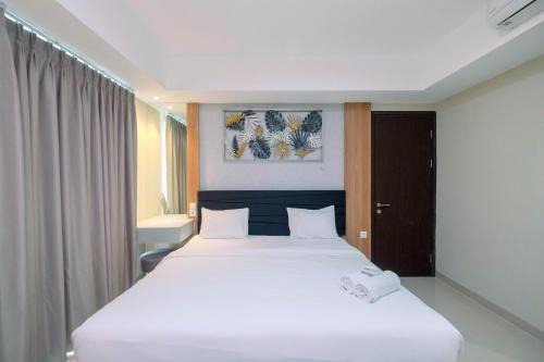 Mampang Prapatan Apartment | Cozy 2BR Apartment Nine Residence with City View By Travelio