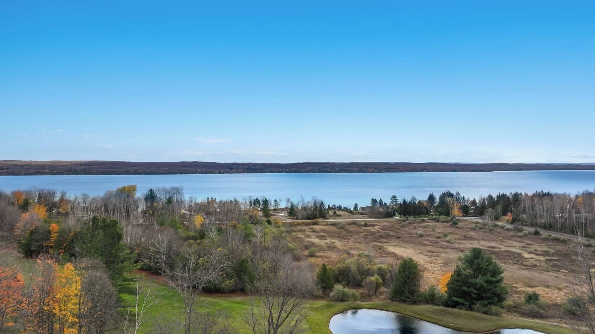Kewadin Condo | Cozy 3-bedroom condo overing looking Torch Lake on the A-Ga-Ming Golf Course