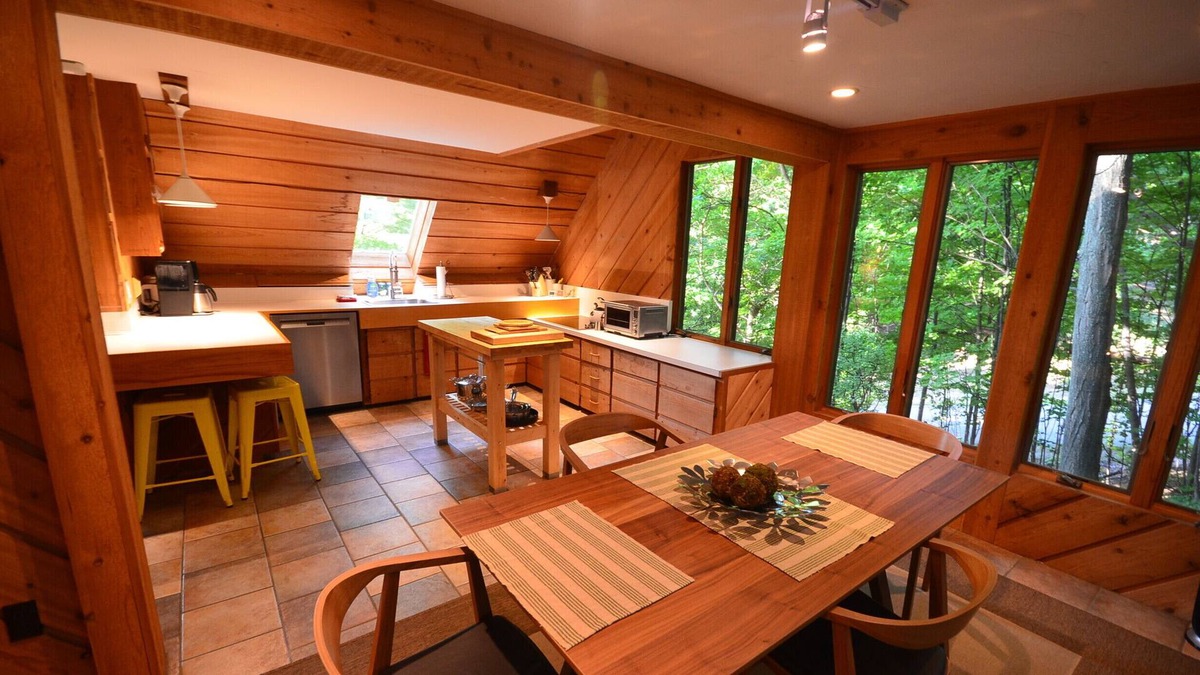Suttons Bay Cabin | Cozy cottage high in the trees. Walk to the beach. Small dog considered.