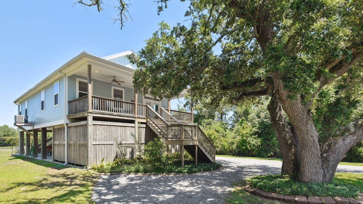 Henderson Point House | Cozy cottage surrounded by woods and just a short walk to the beach!