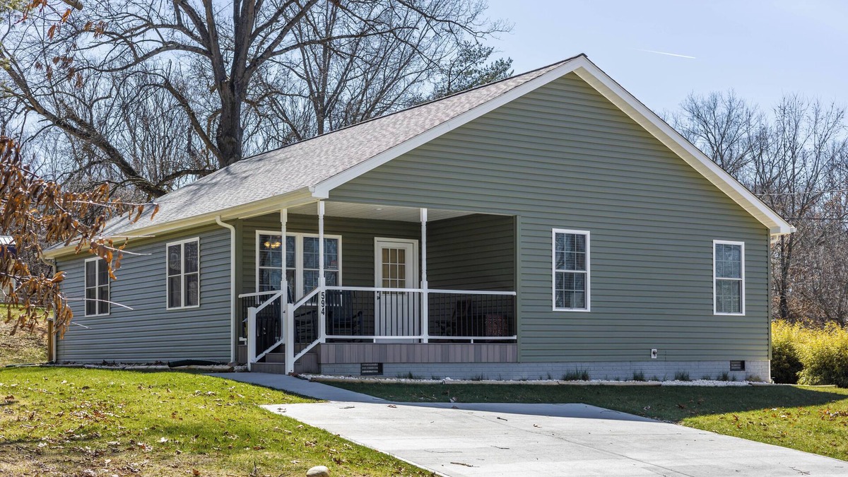 Radford House | Cozy home with a modern kitchen, spacious living, serene bedrooms, and a private deck for relaxation