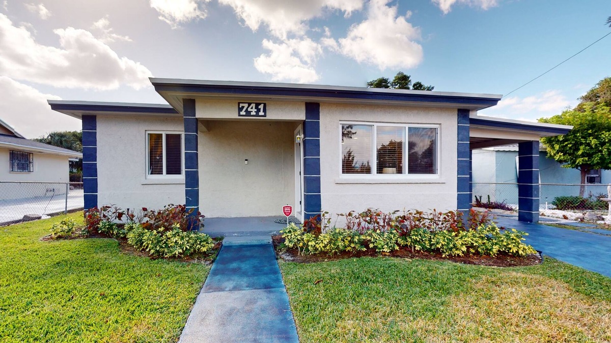 Riviera Beach House | Cozy home with B.B.Q.grill, hot tub, central AC, and enclosed yard